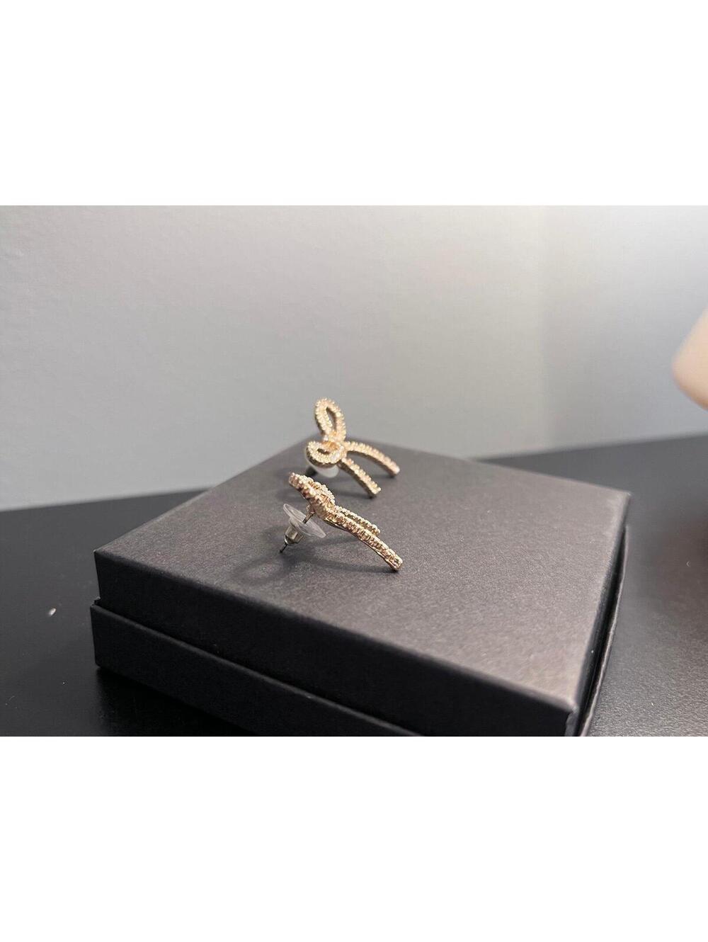 Bow Shaped Stud Earrings in Gold w/ Pave Cubic Zirconia - Picture 5 of 11